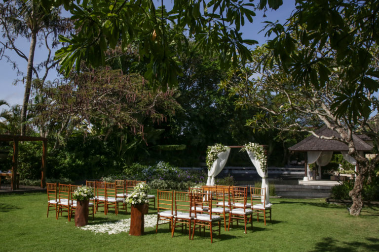 Beautiful romantic outdoor wedding setup in tropical garden, woo